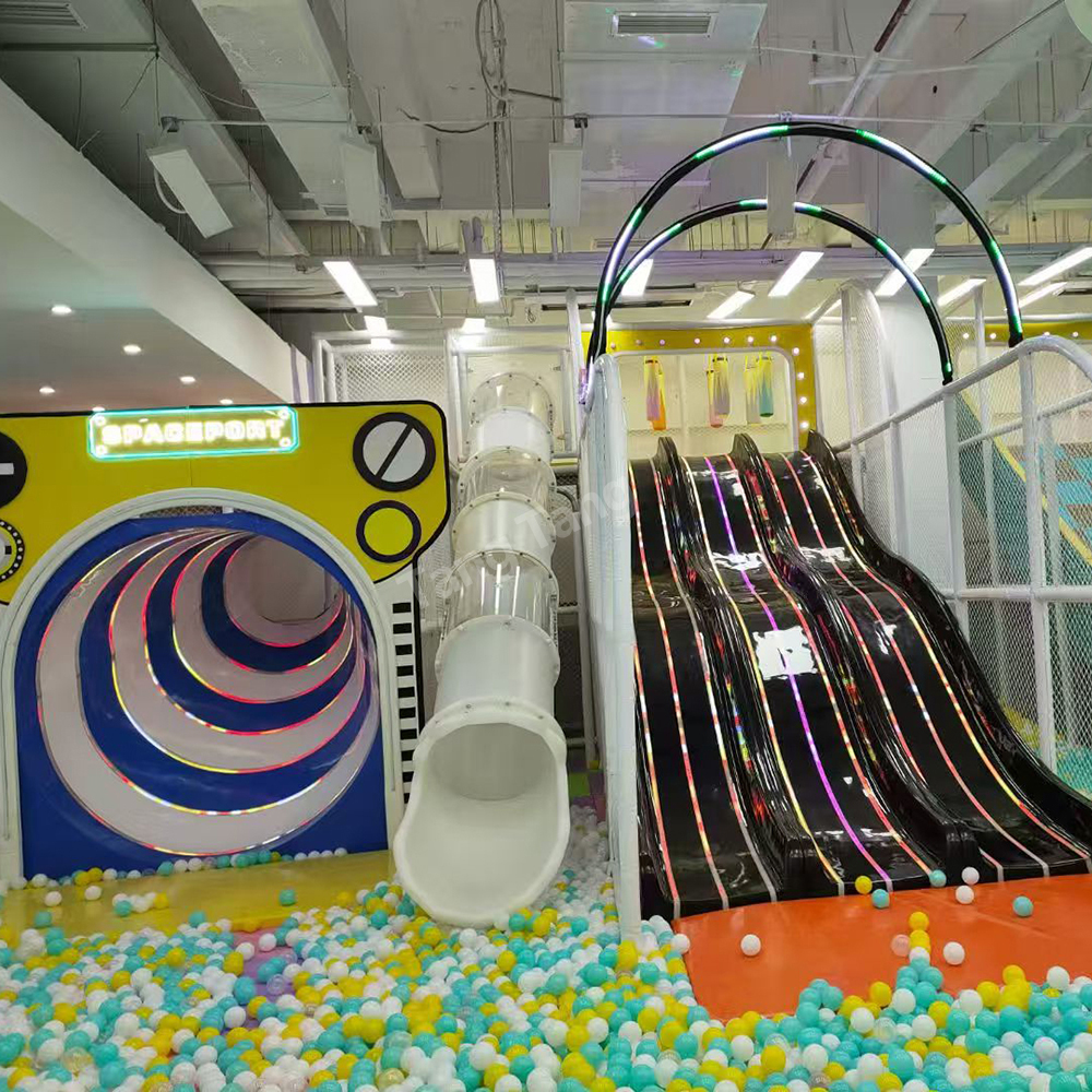 Commercial indoor playground with racing slides and ball pool